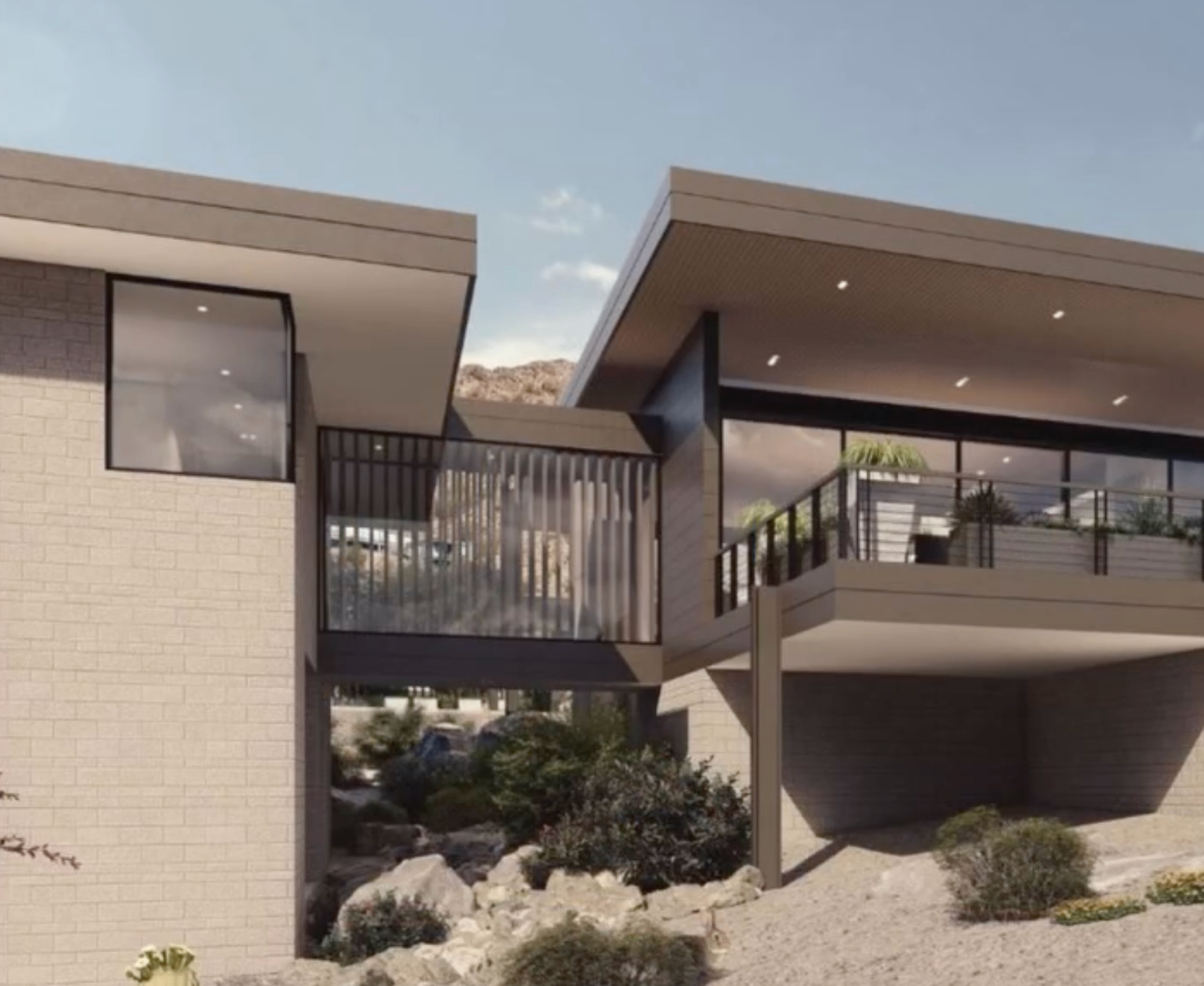 Modern estate exterior with angular architecture and desert landscaping.