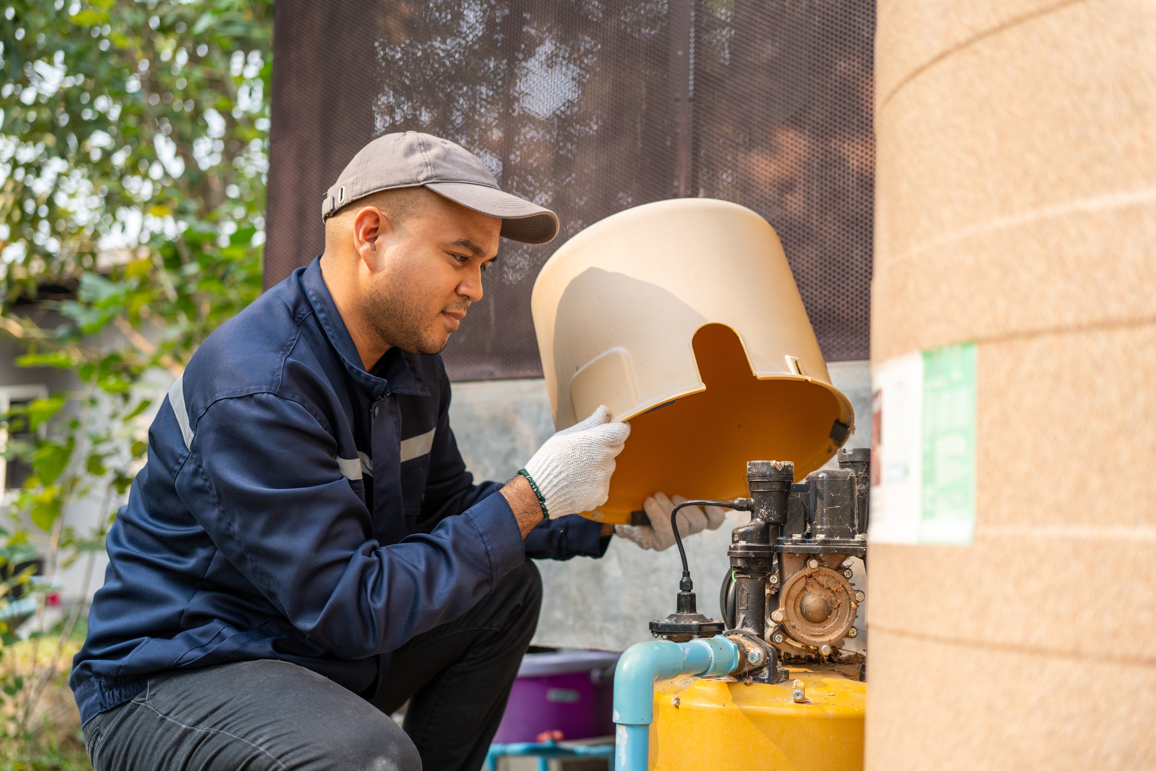 Technician inspecting estate mechanical equipment.
